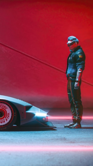 Man in VR goggles next to Quadra Turbo R V Tech car