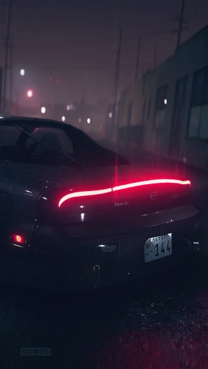 Mazda RX-7 in the rain at night