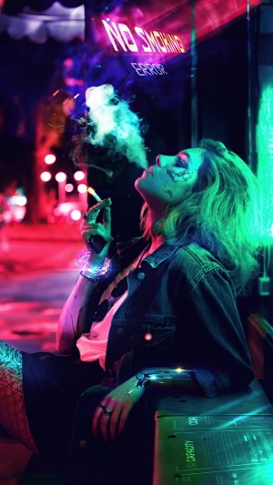 Cyborg woman smoking in neon city