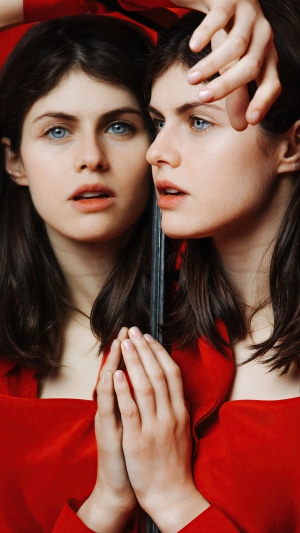 Alexandra Daddario in a red dress, reflection