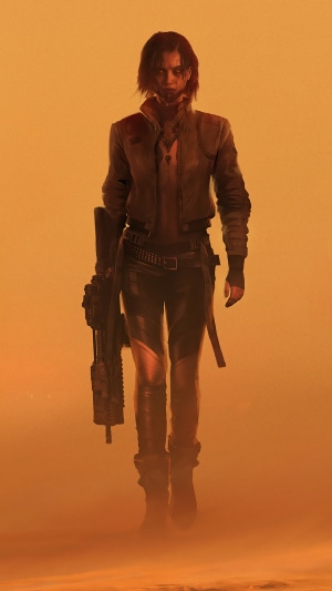 Woman with a gun in a desert