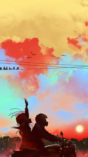 Couple riding a motorcycle at sunset with birds
