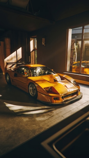 Orange Ferrari F40 in a dimly lit garage