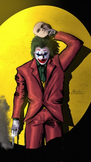 Joker holding a mask and a gun