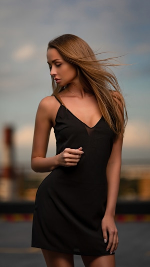Model in a black dress outdoors