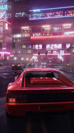Red sports car driving through a neon-lit city at night