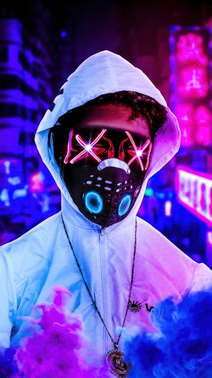 Person wearing a mask and hoodie with neon lights