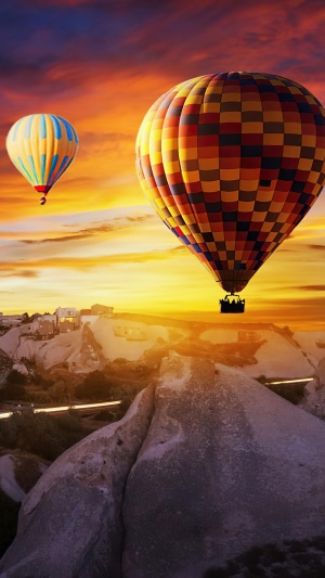 Hot air balloons over Cappadocia at sunset