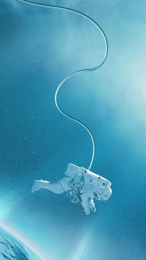 Astronaut floating in space with Earth below