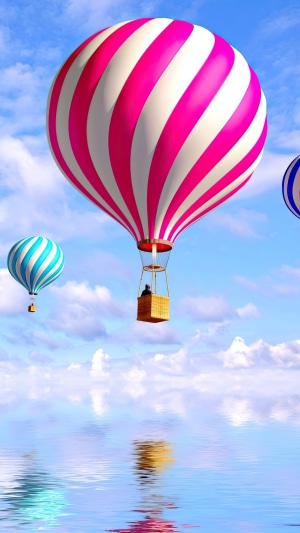 Hot air balloons over water