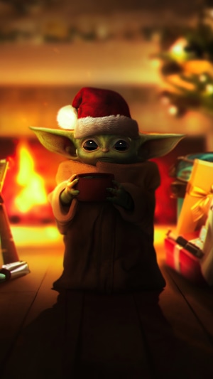 Baby Yoda from The Mandalorian wearing a Santa hat