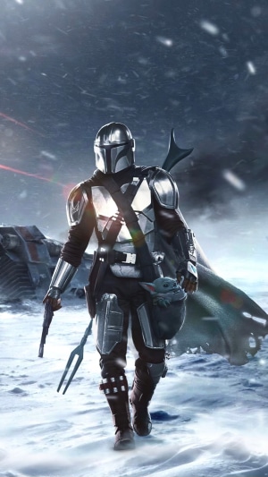 The Mandalorian and Grogu in a snowy landscape