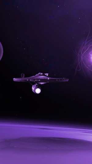 Star Trek spaceship in space near a planet