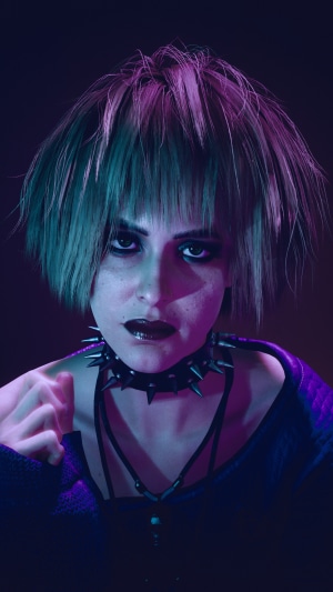 Woman with punk hairstyle and spiked collar
