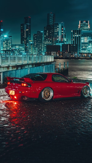 Red Mazda RX7 Sports Car at Night in City