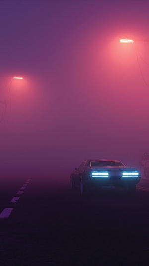 Car driving on a foggy road at night