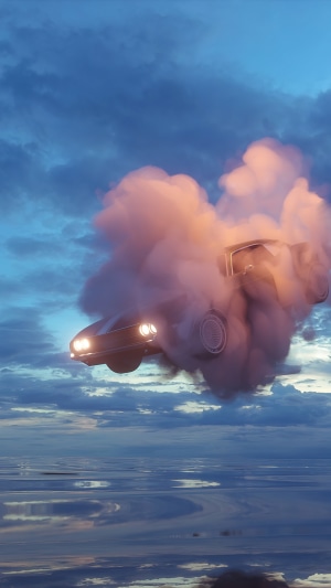 Car in clouds over water