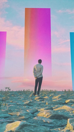 Man standing in front of colorful pillars