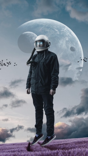Astronaut floating in a field with planets in the background
