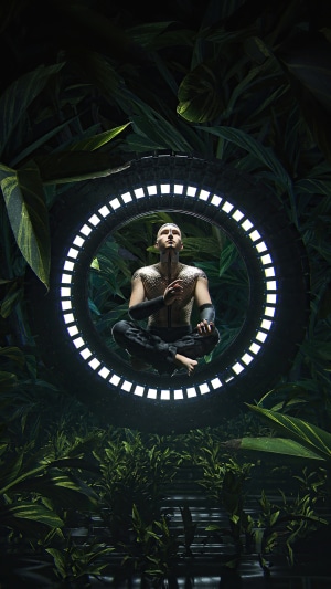 Man meditating in a glowing ring surrounded by jungle