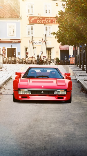 Red Ferrari 288 GTO parked on a street