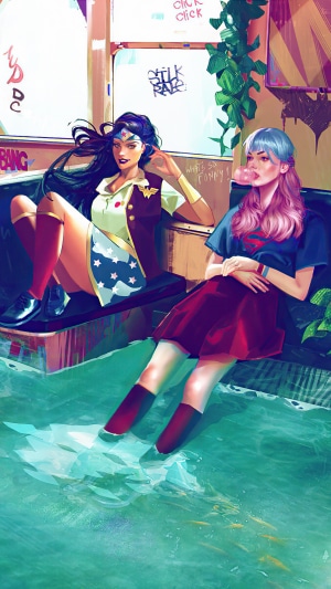 Wonder Woman and Supergirl in water