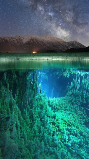 Milky Way over Mountains and Underwater Cave
