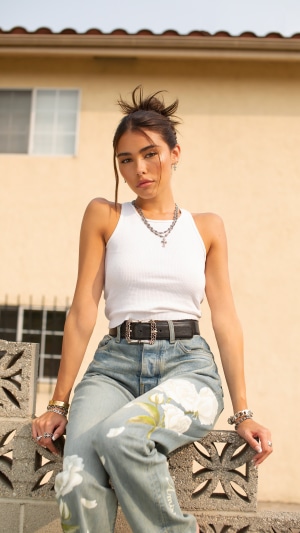 Madison Beer in white tank top and jeans