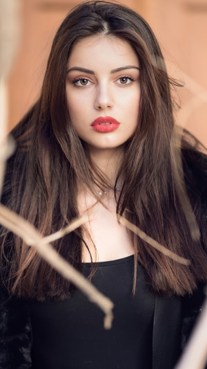 Model wearing a black jacket and top