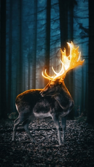 Fantasy deer with glowing antlers in a dark forest