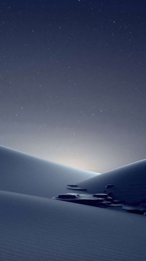 Desert dunes under a starry sky