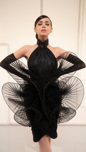 Sofia Carson in a black avant-garde dress