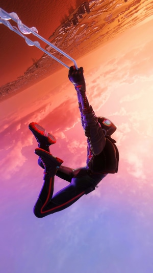 Spider-Man Miles Morales swinging through the city at sunset
