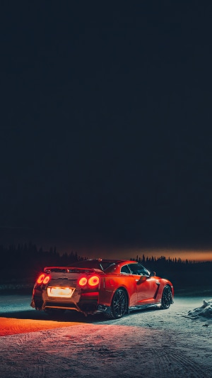 Red Nissan GT-R in Snowy Landscape