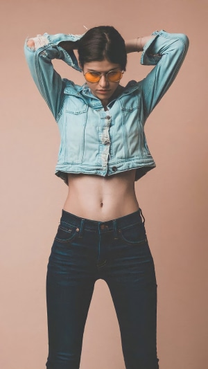 Alexandra Daddario in a denim jacket and jeans