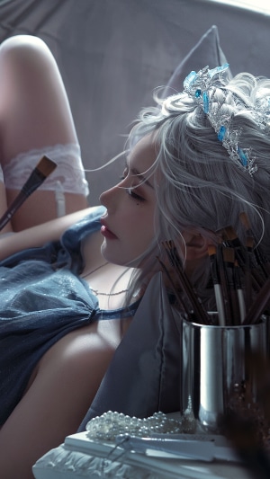 Fantasy artist with silver hair and crown