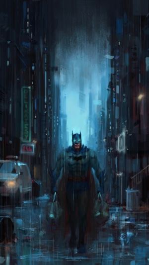 Batman walking in a rainy city street