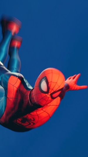 Spider-Man from Marvel falling against a blue background