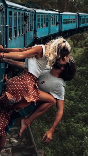Couple kissing on a train