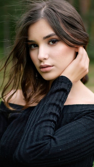 Model in black off-the-shoulder top