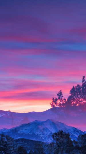 Sunset over mountains with trees, 4K