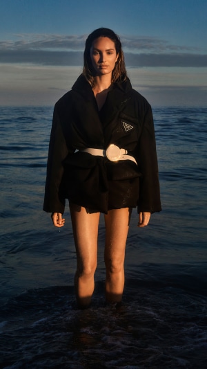 Candice Swanepoel in Prada jacket on the ocean