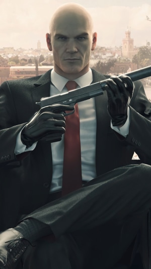 Agent 47 from Hitman holding a silenced pistol