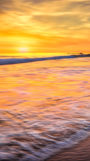 Ocean sunset with long exposure waves