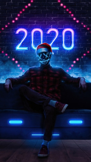 Person in mask with 2020 neon sign