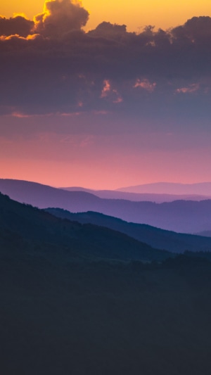 Mountains at sunset with purple and orange sky