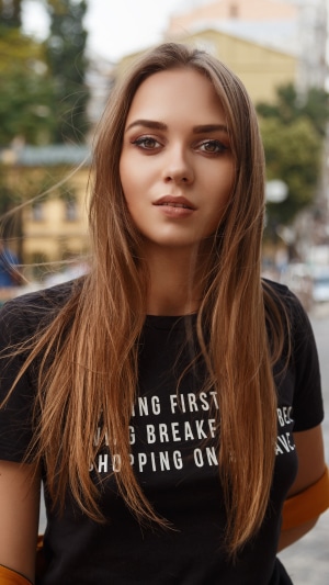 Model in black t-shirt with text
