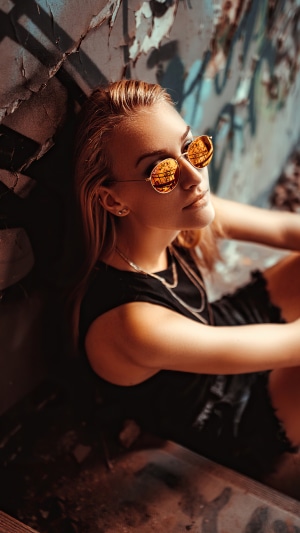 Woman wearing sunglasses and black dress