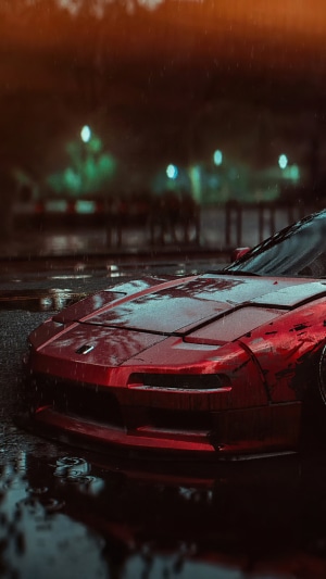 Red Honda NSX in the rain at night