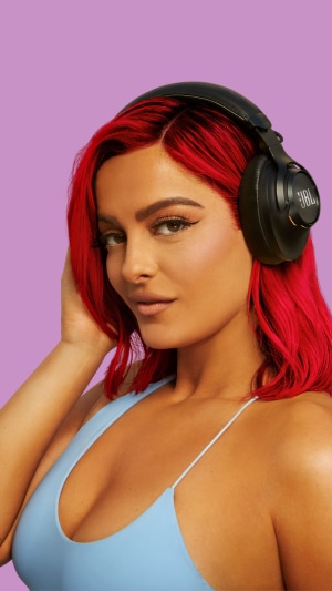 Bebe Rexha wearing JBL headphones
